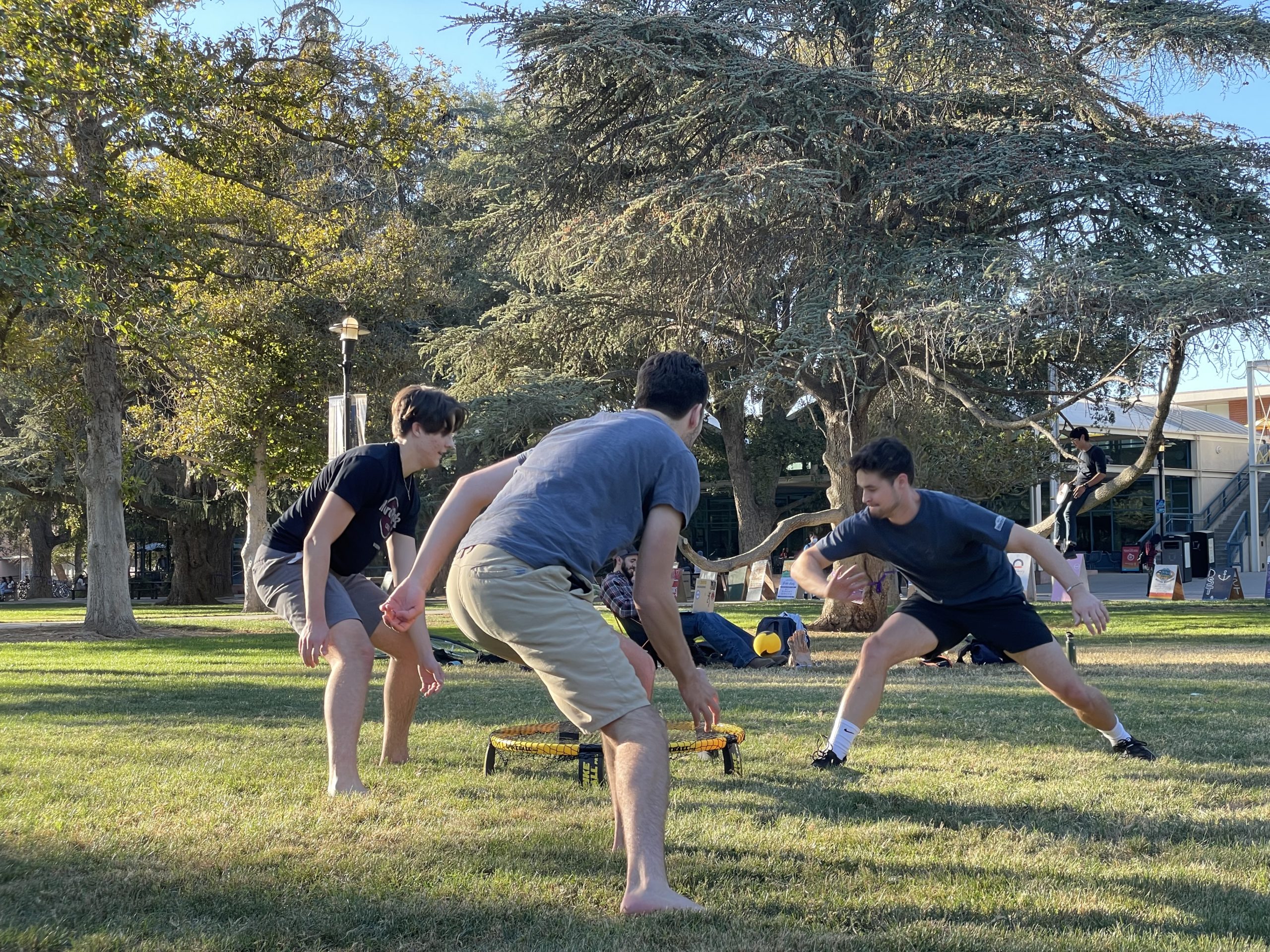 college students playing spikeball at the UC Davis Quad